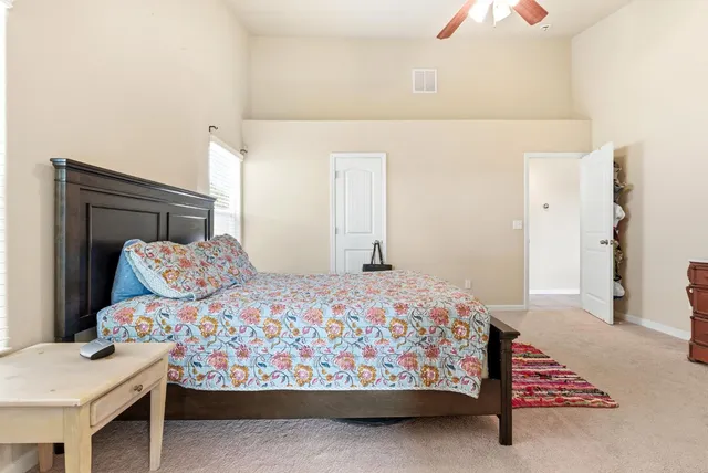 a spacious bathroom with a granite countertop tub sink and mirror