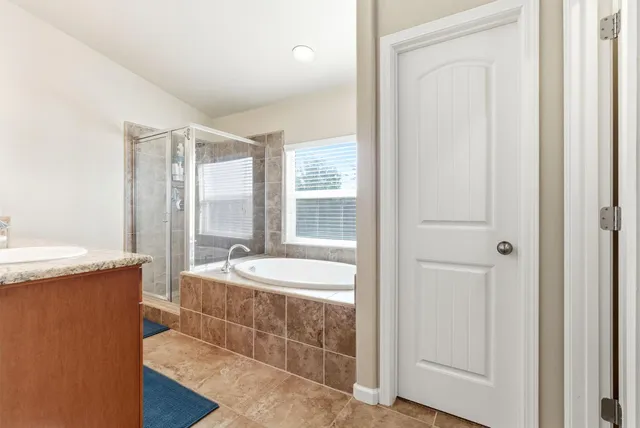 a bathroom with a sink a mirror and a toilet