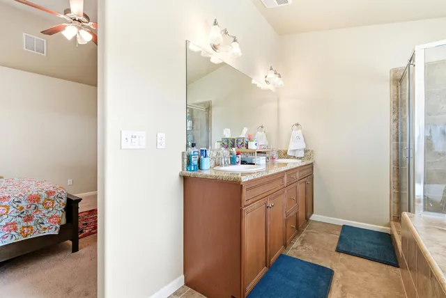 a bathroom with a tub and shower