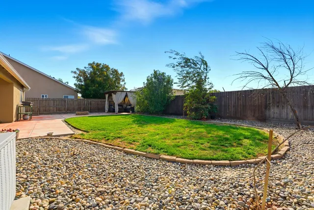 an aerial view of a house a yard and a garage