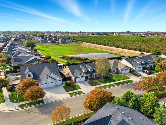 an aerial view of a house with a garden