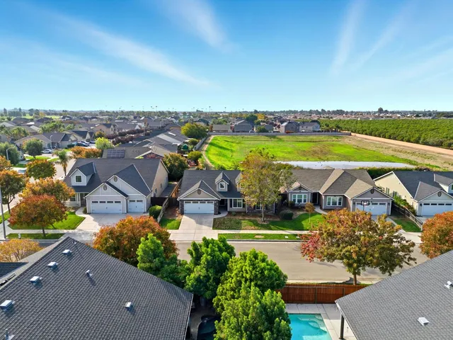an aerial view of a house with a garden