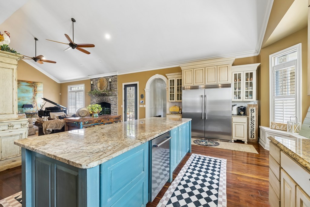 3631 Louisville Road Louisville, TN 37777 - Photo 14 of 64 a kitchen with stainless steel appliances granite countertop a sink a stove and a refrigerator