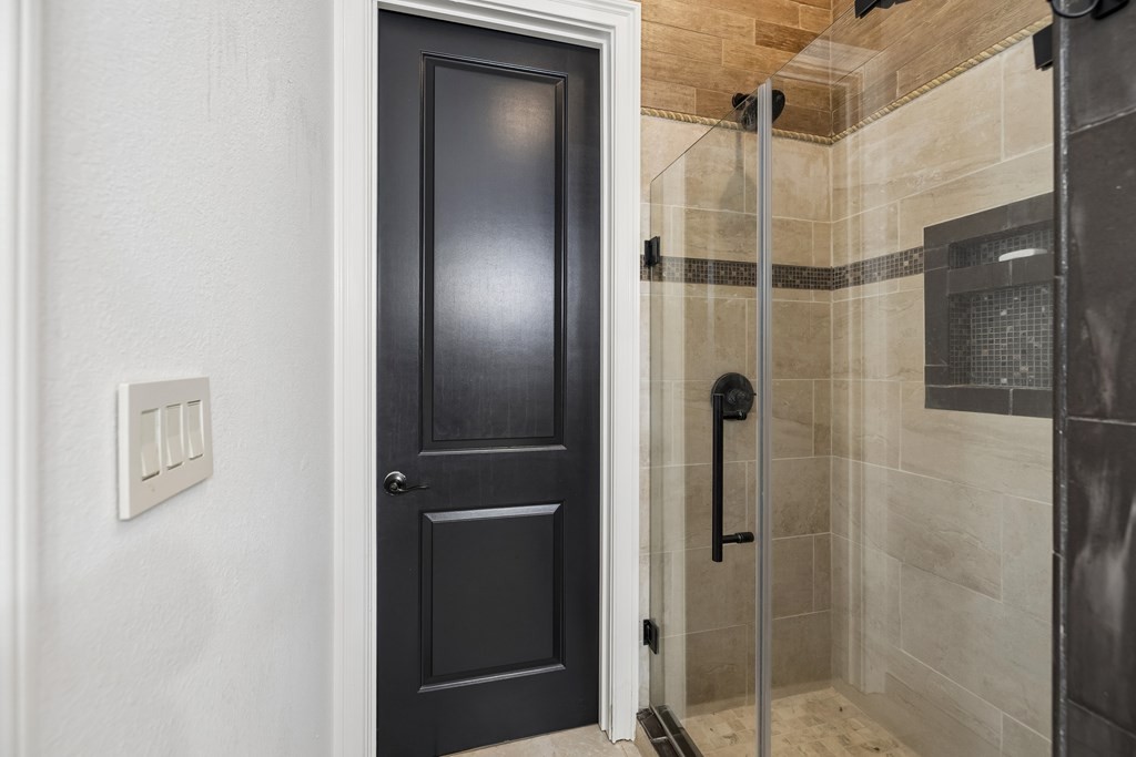 3631 Louisville Road Louisville, TN 37777 - Photo 31 of 64 a bathroom with a shower and a mirror