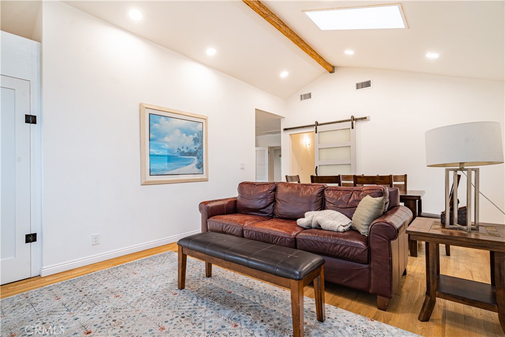 357 Whiting Street El Segundo, CA 90245 - Photo 14 of 50 a living room with furniture and a wooden floor
