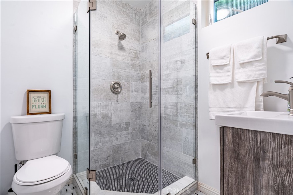 357 Whiting Street El Segundo, CA 90245 - Photo 23 of 50 a bathroom with a shower a toilet and a sink