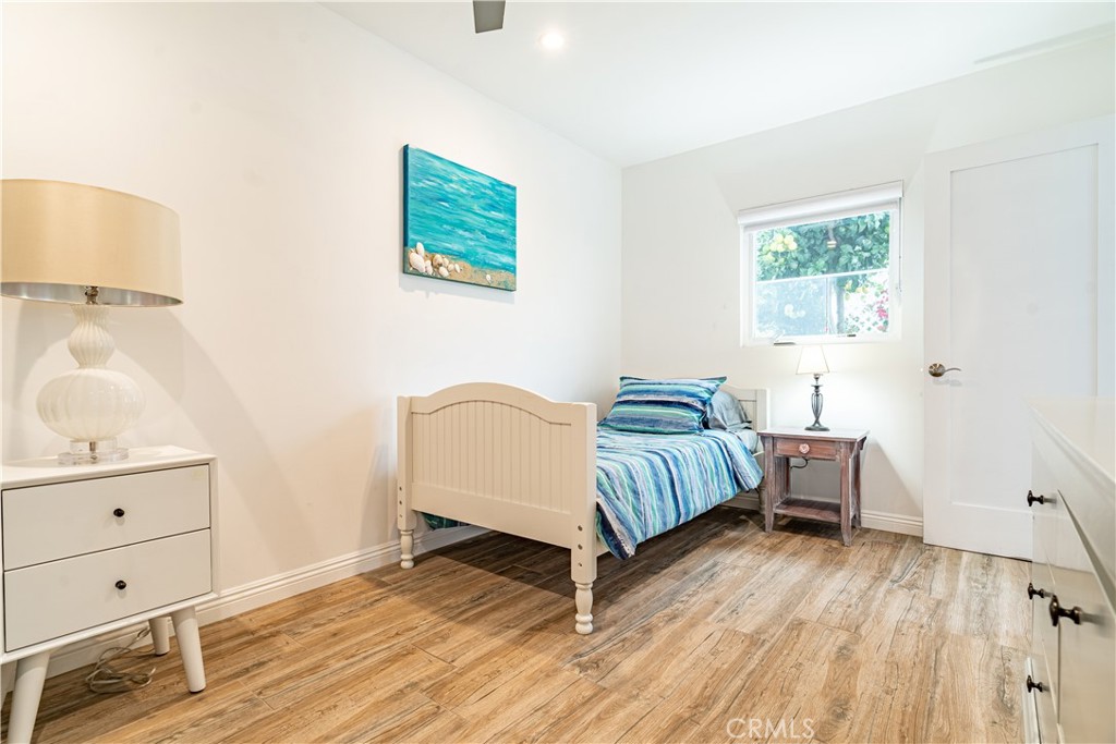 357 Whiting Street El Segundo, CA 90245 - Photo 24 of 50 a bedroom with a bed and painting on the wall