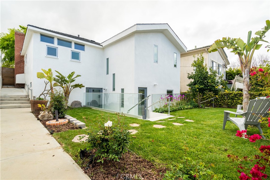 357 Whiting Street El Segundo, CA 90245 - Photo 33 of 50 a front view of a house with garden