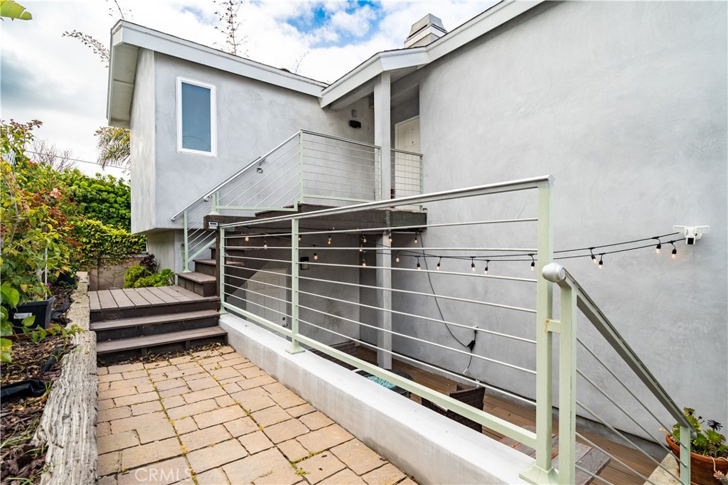 357 Whiting Street El Segundo, CA 90245 - Photo 37 of 50 a view of a house with a window and wooden fence