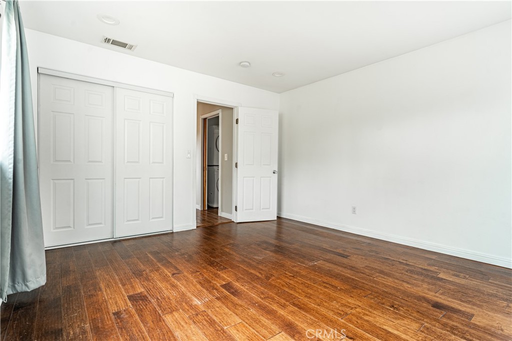 357 Whiting Street El Segundo, CA 90245 - Photo 44 of 50 a view of an empty room with wooden floor