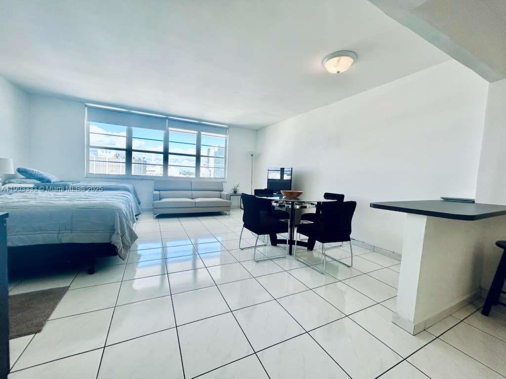 100 Lincoln Road, Unit 1639 Miami Beach, FL 33139 - Photo 2 of 10 a bed room with a bed and a window