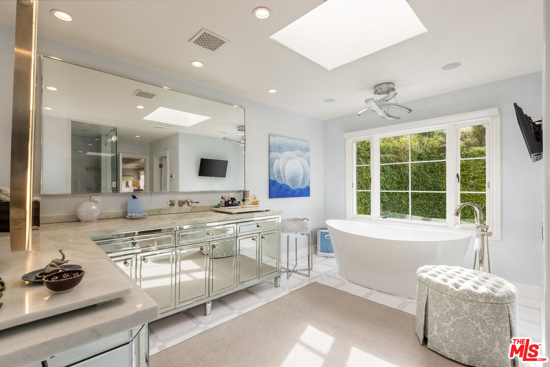 1109 Tower Road Beverly Hills, CA 90210 - Photo 24 of 32 a large white kitchen with a large window