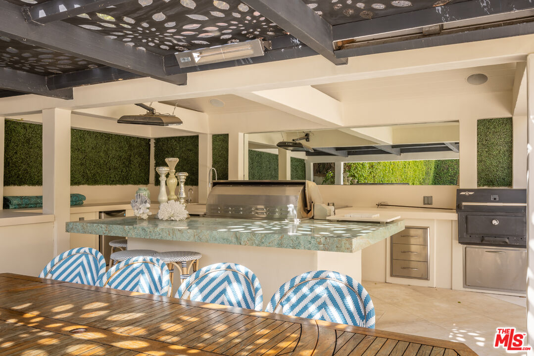 1109 Tower Road Beverly Hills, CA 90210 - Photo 30 of 32 a view of a living room and kitchen