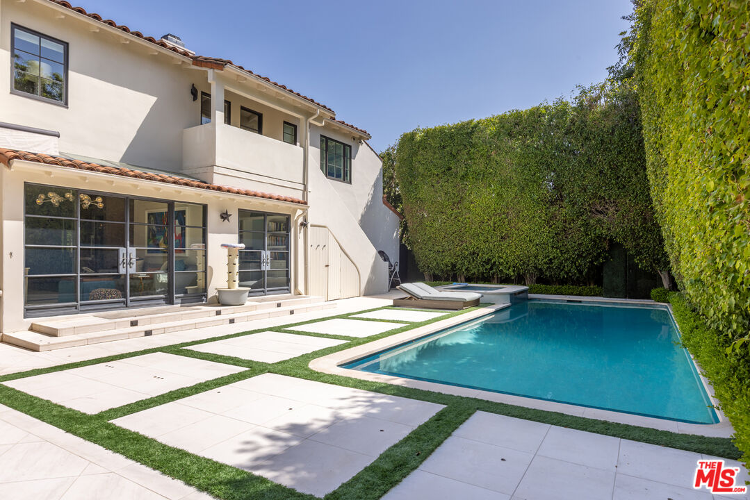 1109 Tower Road Beverly Hills, CA 90210 - Photo 32 of 32 a view of a house with a backyard