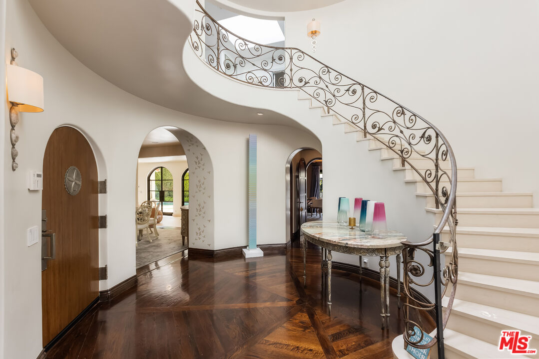 1109 Tower Road Beverly Hills, CA 90210 - Photo 6 of 32 a view of entryway with kitchen and dining room