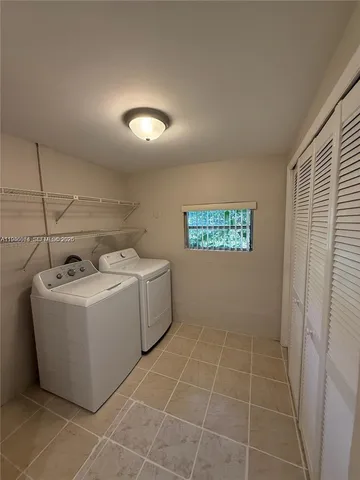 a utility room with a washer and dryer