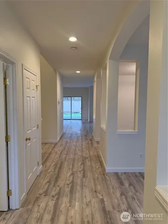 a bathroom with a glass shower door