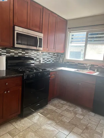 a kitchen with a stove and a microwave