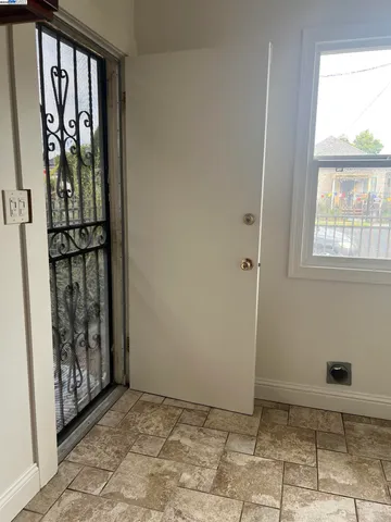 a view of an entryway with wooden floor