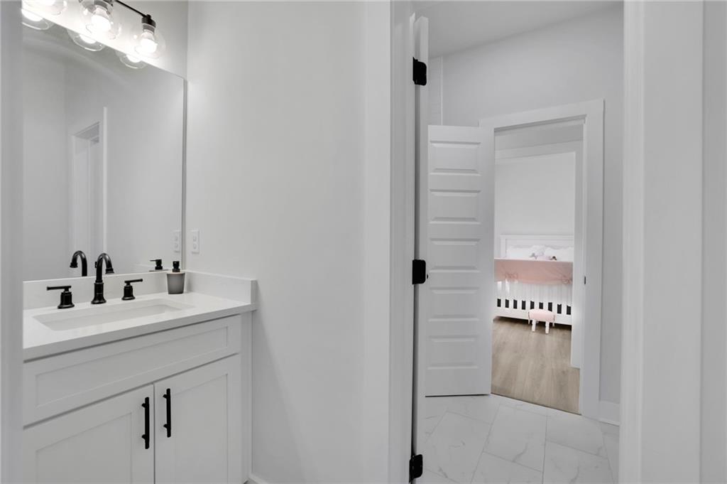 1610 Double Springs Church Road Monroe, GA 30656 - Photo 14 of 81 a bathroom with a sink a mirror and a shower