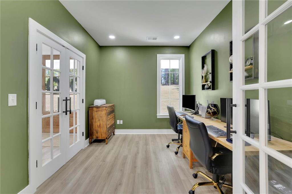 1610 Double Springs Church Road Monroe, GA 30656 - Photo 19 of 81 a workspace with wooden floor and windows