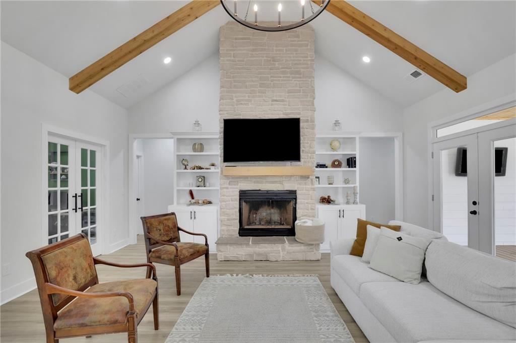 1610 Double Springs Church Road Monroe, GA 30656 - Photo 25 of 81 a living room with furniture a fireplace and a flat screen tv