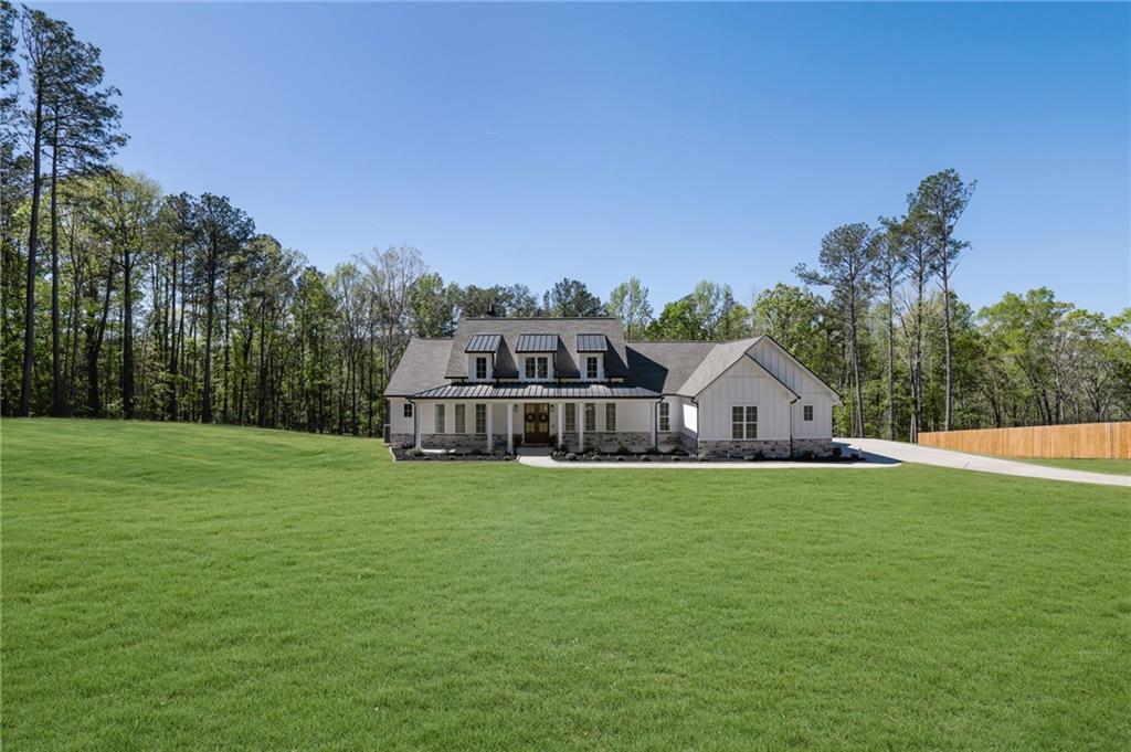 1610 Double Springs Church Road Monroe, GA 30656 - Photo 3 of 81 a front view of a house with a yard