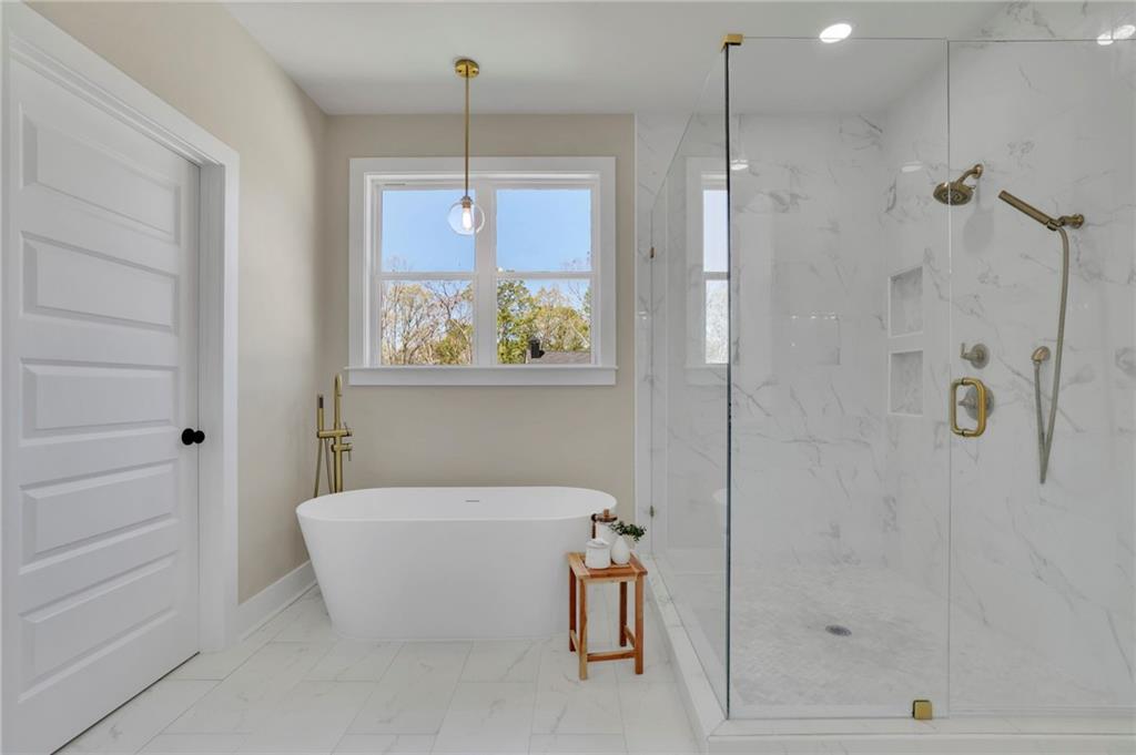 1610 Double Springs Church Road Monroe, GA 30656 - Photo 49 of 81 a bathroom with a tub and shower