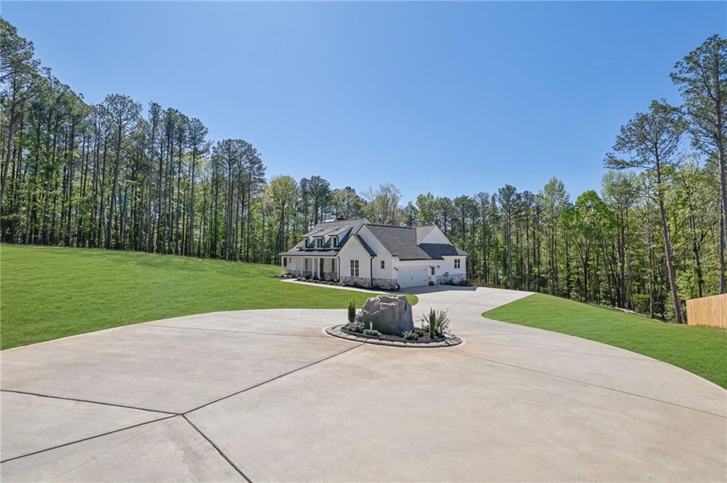 1610 Double Springs Church Road Monroe, GA 30656 - Photo 6 of 81 a view of a house with a yard and pathway