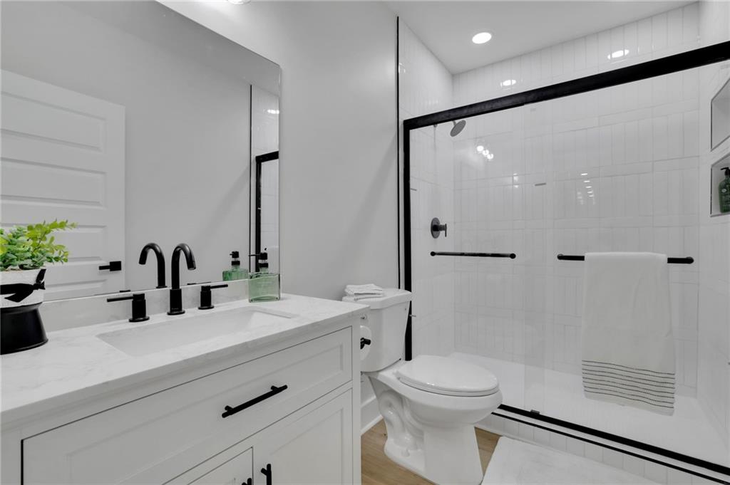 1610 Double Springs Church Road Monroe, GA 30656 - Photo 65 of 81 a bathroom with a sink a toilet a mirror and shower