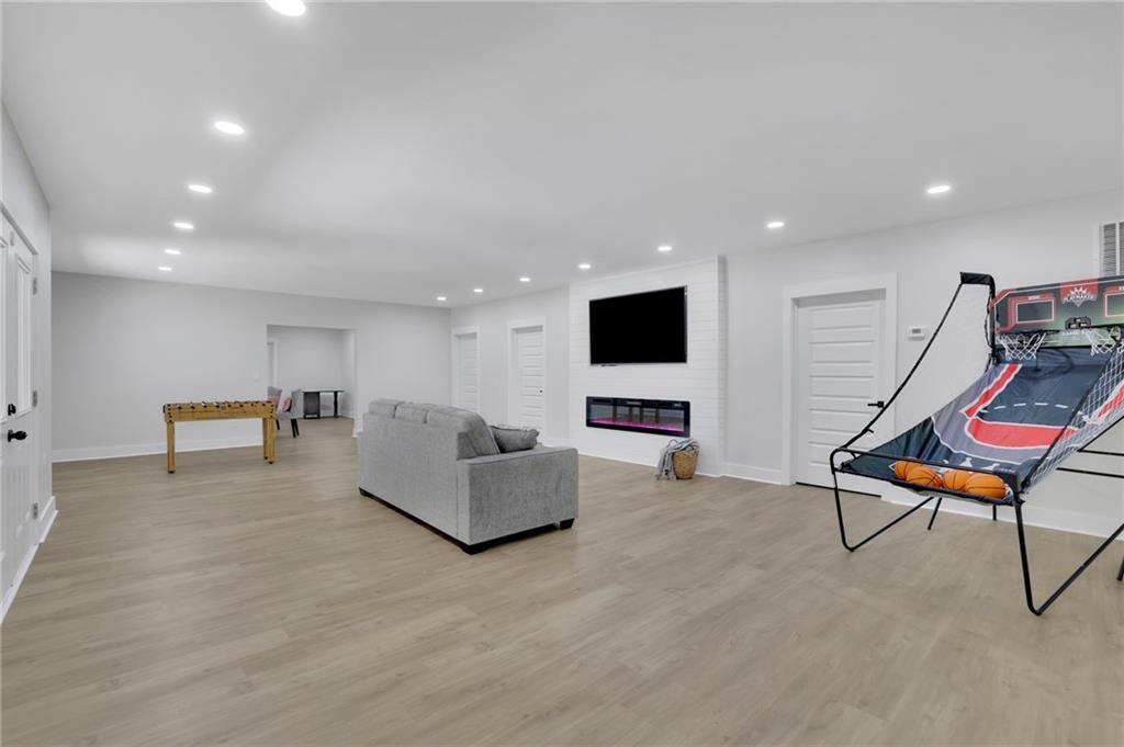 1610 Double Springs Church Road Monroe, GA 30656 - Photo 68 of 81 a living room with furniture and a flat screen tv
