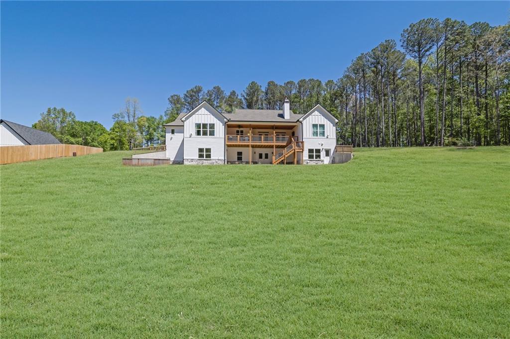 1610 Double Springs Church Road Monroe, GA 30656 - Photo 75 of 81 a front view of a house with a garden