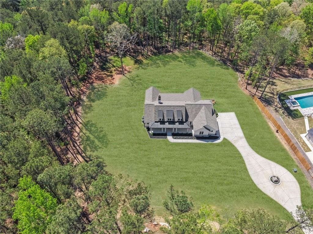 1610 Double Springs Church Road Monroe, GA 30656 - Photo 80 of 81 an aerial view of a house with a garden and lake view