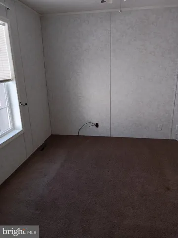 a view of a small space and hardwood floor