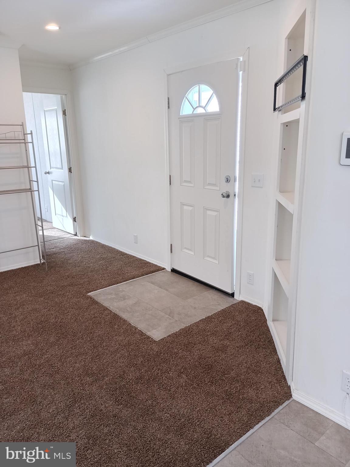 1405 Farrell Avenue, Unit 341 Cherry Hill, NJ 08002 - Photo 3 of 20 a view of an empty room with wooden floor and a window
