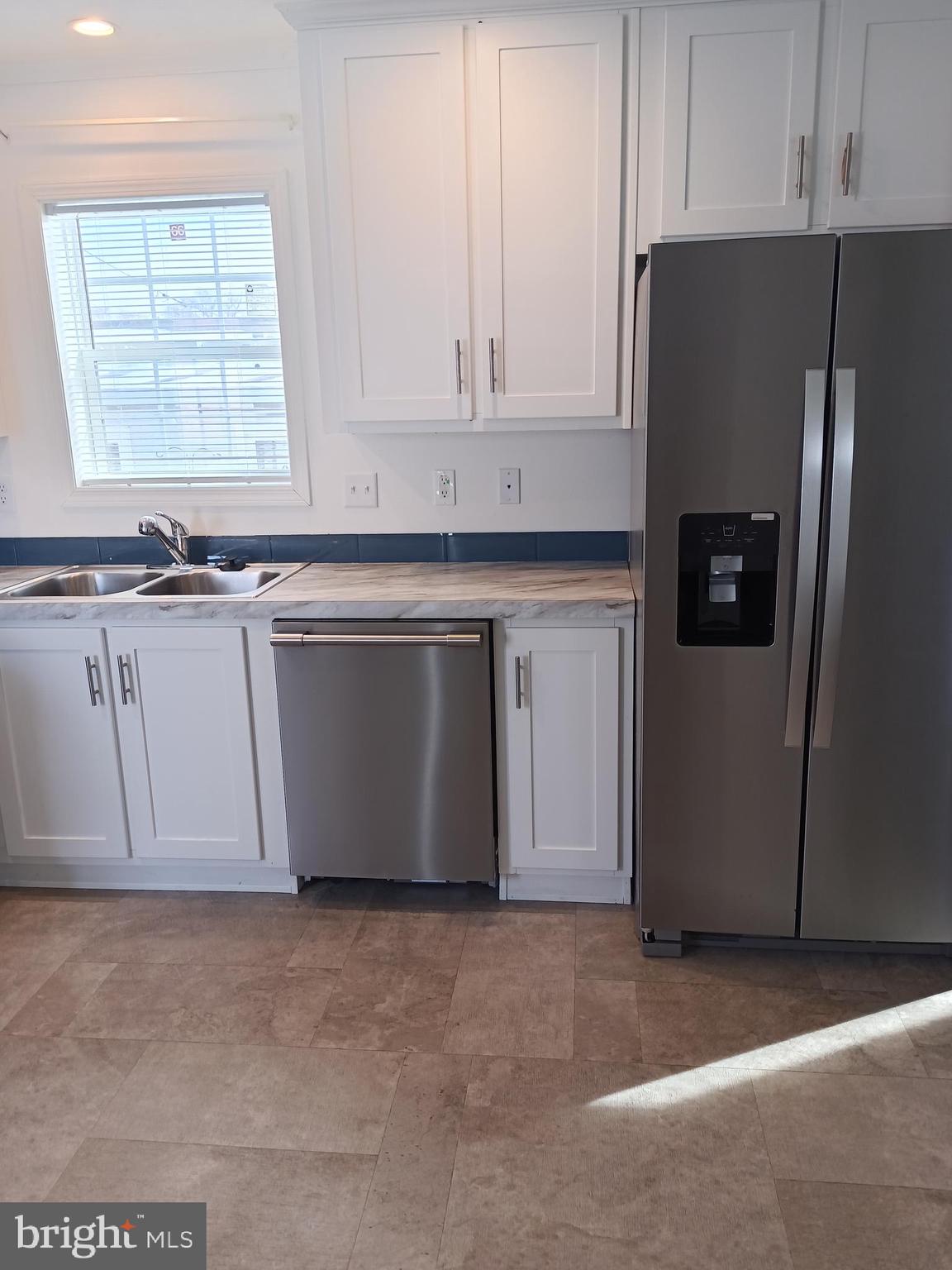 1405 Farrell Avenue, Unit 341 Cherry Hill, NJ 08002 - Photo 5 of 20 a kitchen with stainless steel appliances granite countertop a refrigerator sink and cabinets
