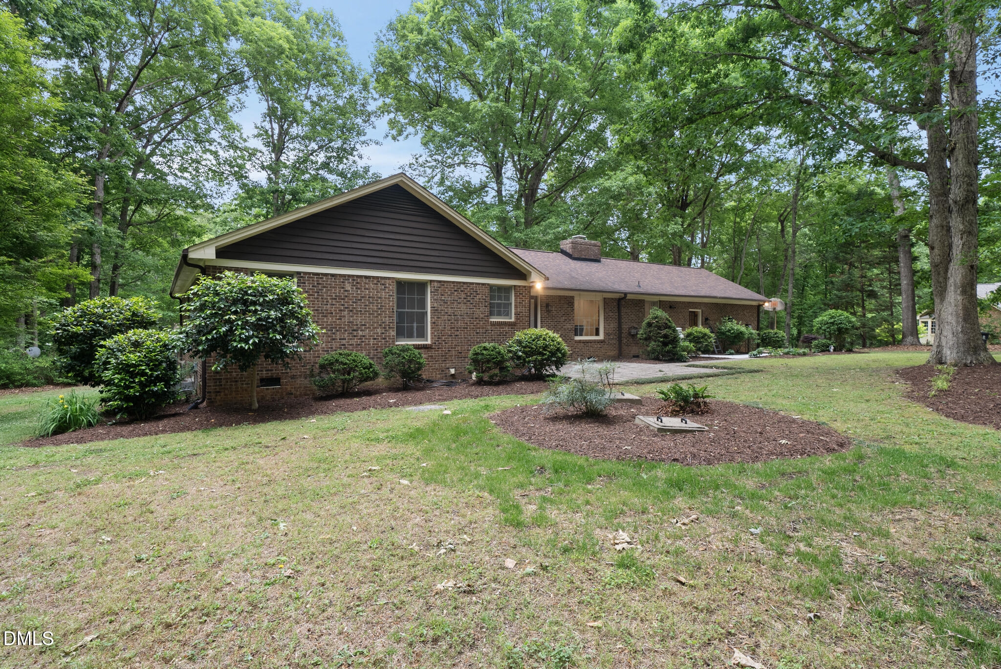 3404 Timberwood Court Raleigh, NC 27606 - Photo 30 of 45 a front view of a house with garden