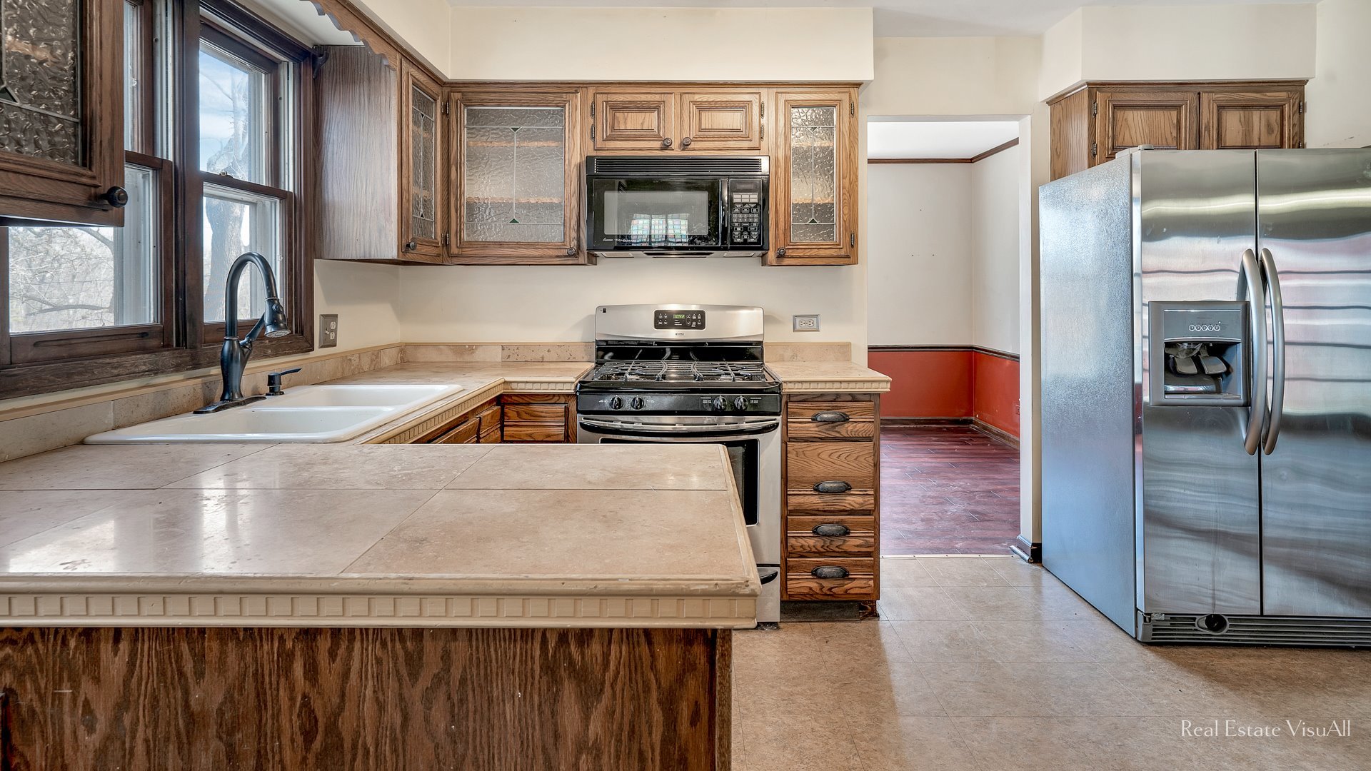 5-n994 Corron Road St. Charles, IL 60175 - Photo 11 of 39 a kitchen with granite countertop a refrigerator stove and microwave