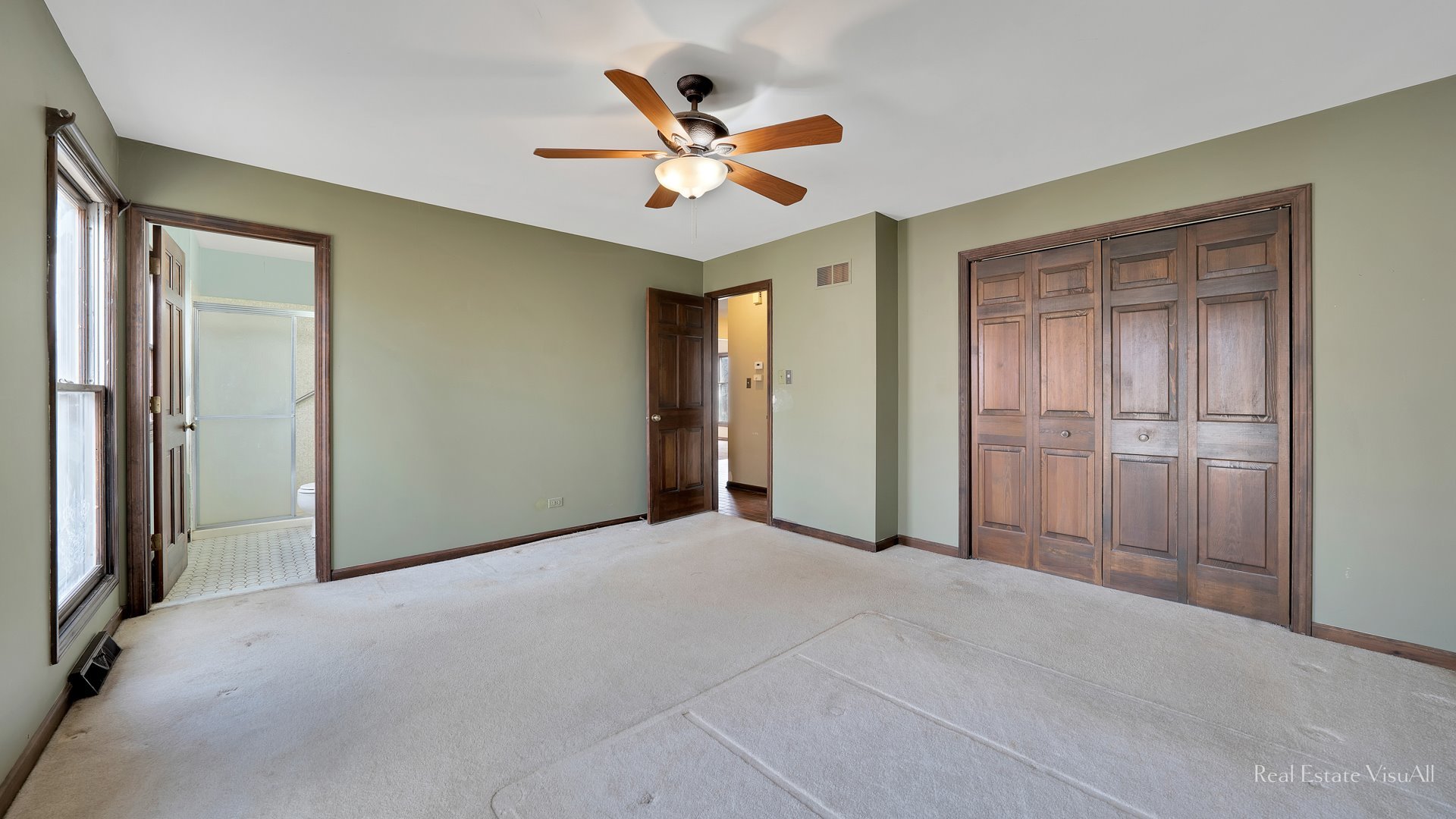 5-n994 Corron Road St. Charles, IL 60175 - Photo 17 of 39 a view of a livingroom with a ceiling fan and closet area