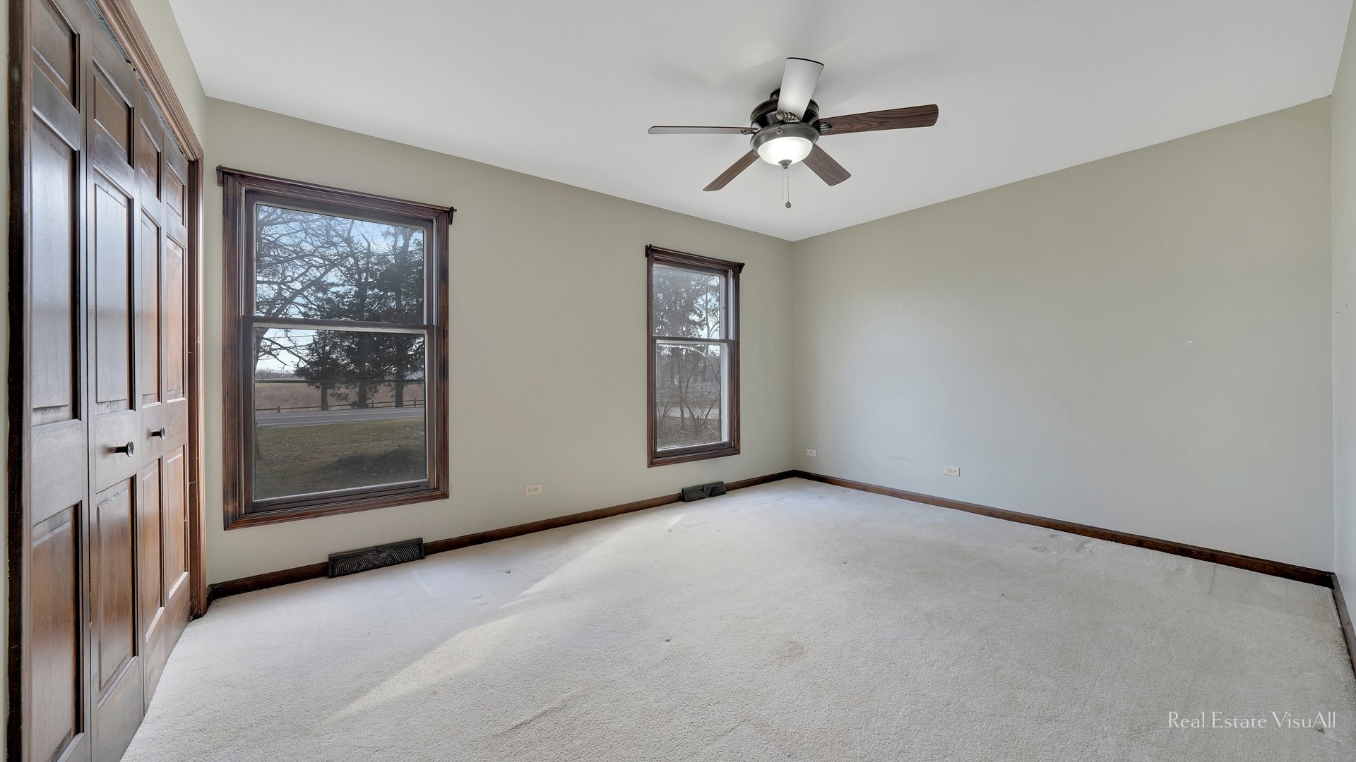 5-n994 Corron Road St. Charles, IL 60175 - Photo 19 of 39 a view of a livingroom with a ceiling fan and windows