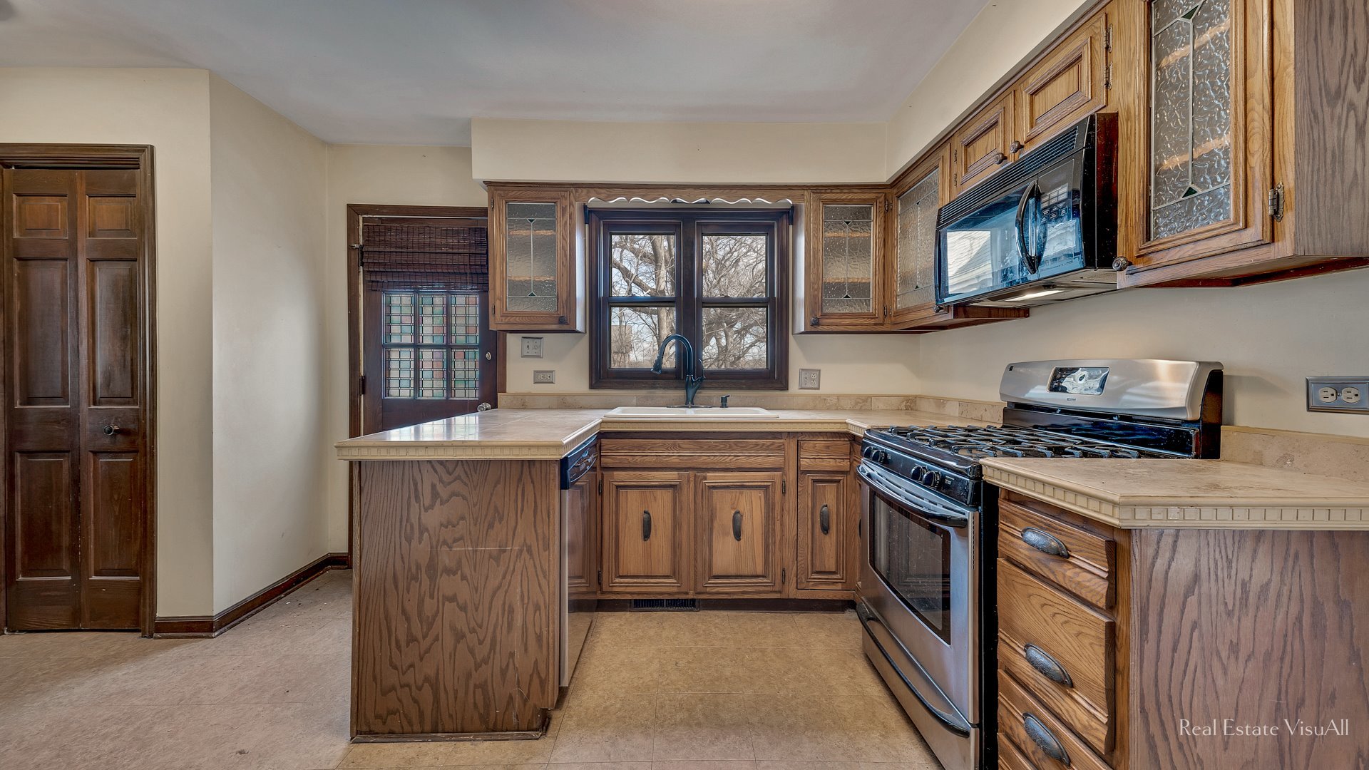 5-n994 Corron Road St. Charles, IL 60175 - Photo 10 of 39 a kitchen with stainless steel appliances granite countertop a stove a sink and a refrigerator