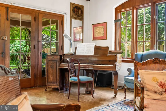 a living room with a window and a table