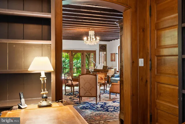 a dining room with furniture and a window