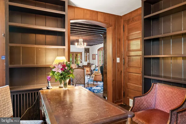 a view of a dining room with furniture and a potted plant