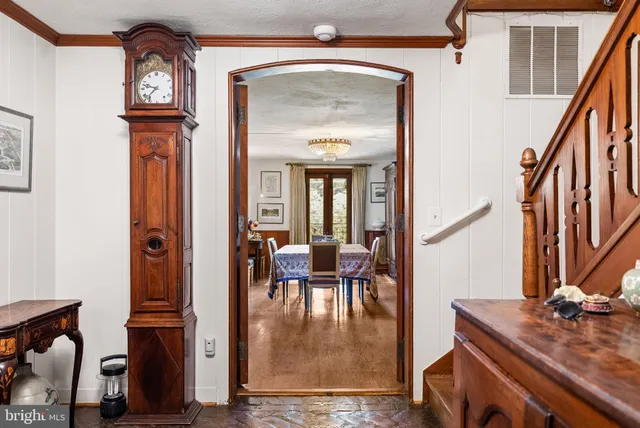 a dining room with furniture and wooden floor