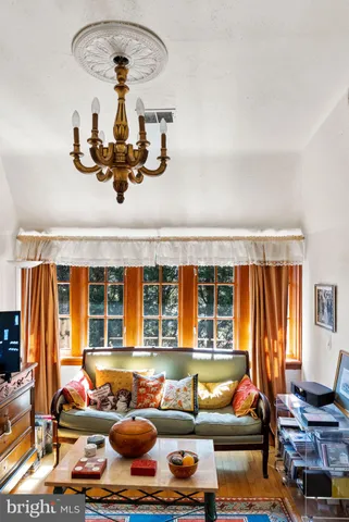 a living room with blue lights with furniture