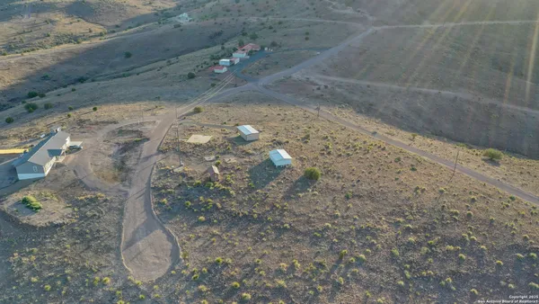 a view of backyard with cabin
