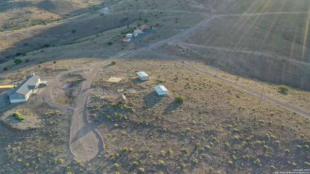 a view of backyard with cabin