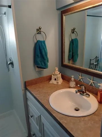 a bathroom with a sink and a mirror