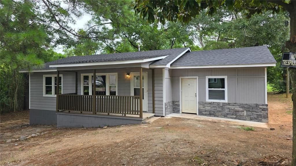 700 New Street Eatonton, GA 31024 - Photo 19 of 19 a house with trees in the background